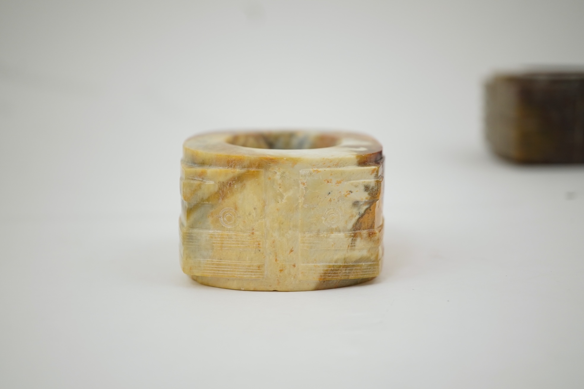 Four Chinese archaistic hardstone or burnt jade cong or cylinders